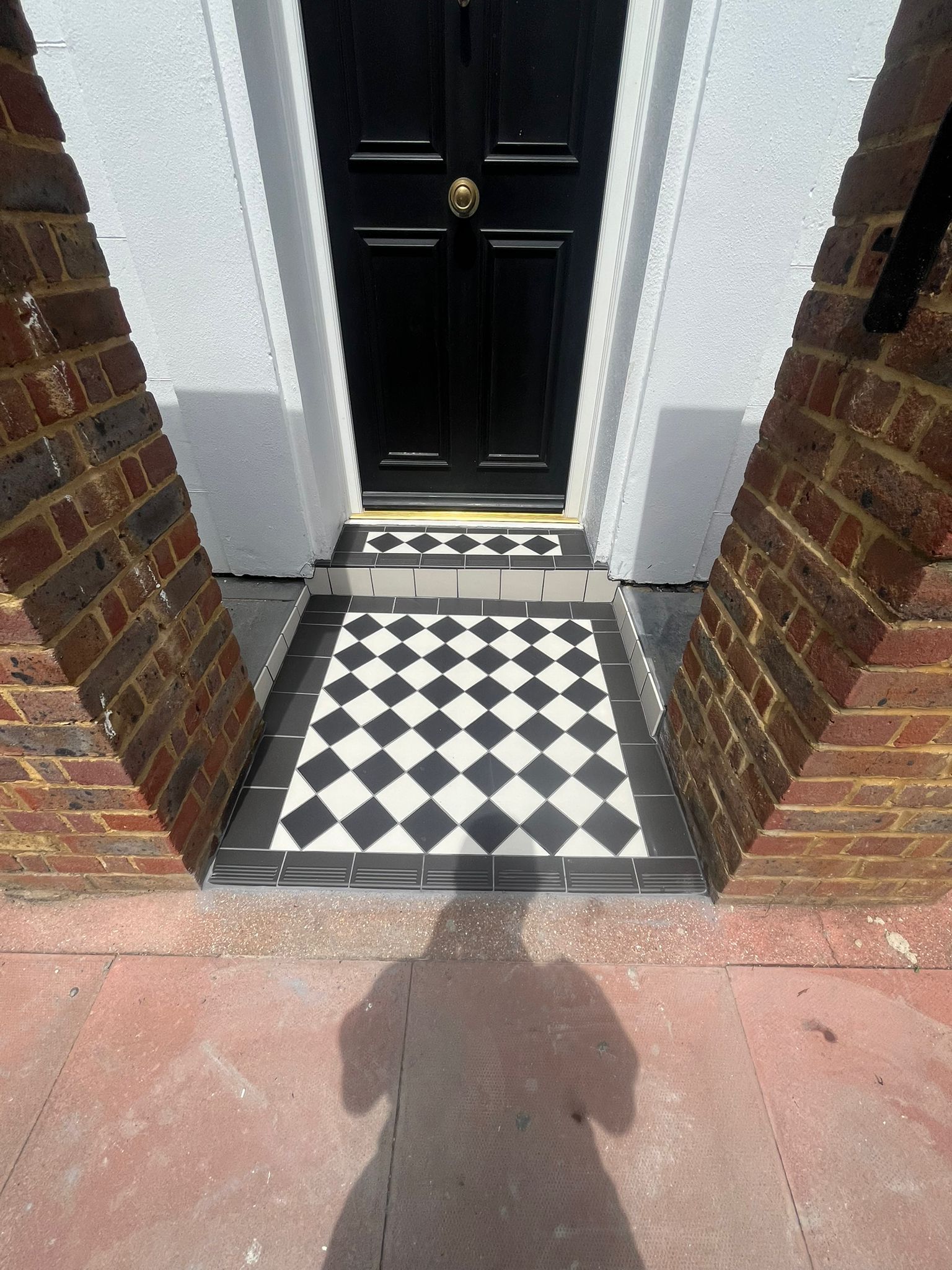 Victorian black and white diamond doorstep tiling